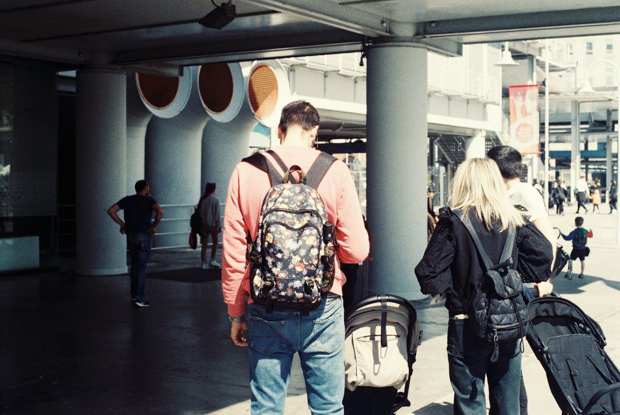 a-man-and-woman-walking-with-a-stroller-27904883.jpeg