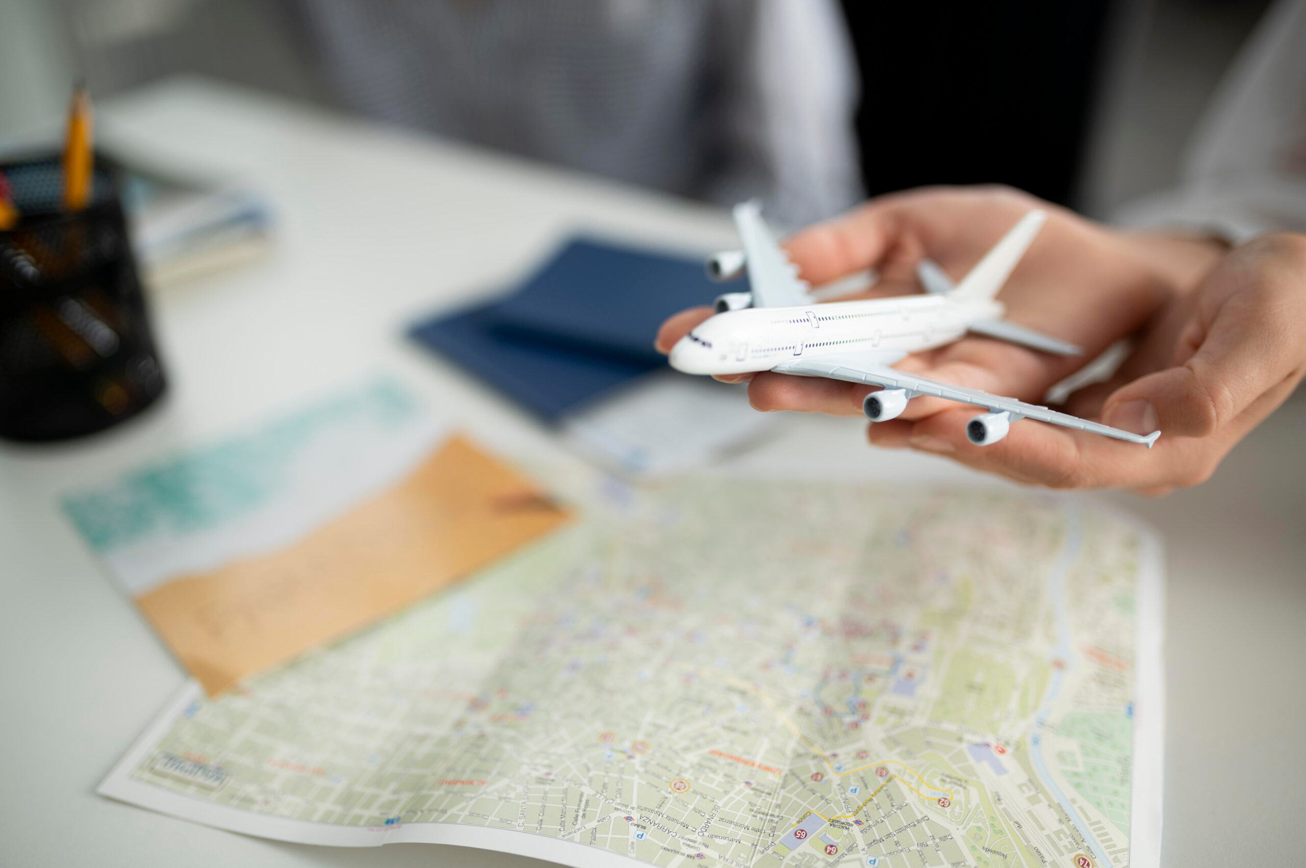close-up-hands-holding-small-plane (1)